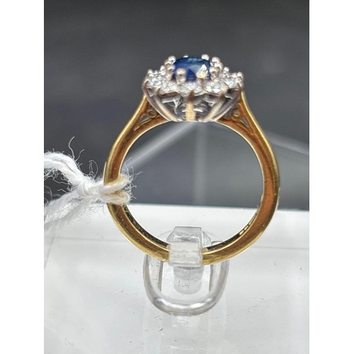 24 - 18ct Sapphire and diamond oval cluster ring, size I, 4.3g