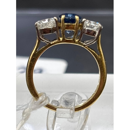 29 - 18ct Sapphire and diamond 3 stone ring, each diamond weighs 0.50cts, size H