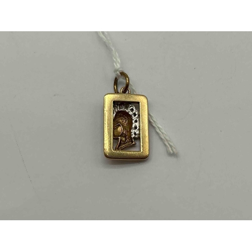44 - A legionnaire pendant set with diamonds 9ct 5.0g