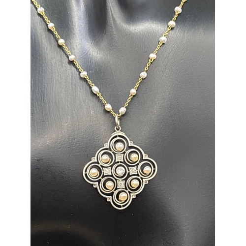 53 - A EDWARDIAN 18CT GOLD AND PLATINUM PEARL AND DIAMOND PENDANT ON 15CT GOLD PEARL CHAIN 17 INCH BOXED