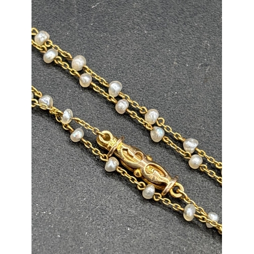 53 - A EDWARDIAN 18CT GOLD AND PLATINUM PEARL AND DIAMOND PENDANT ON 15CT GOLD PEARL CHAIN 17 INCH BOXED