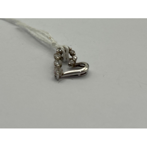 62 - A white gold and CZ heart pendant