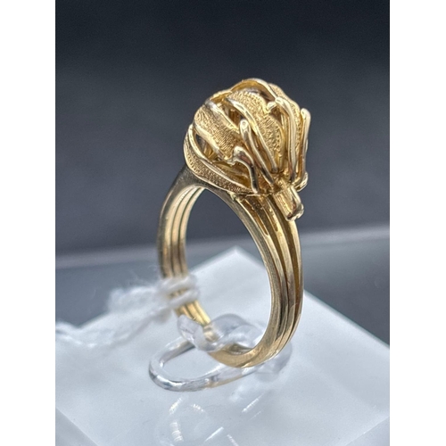 66 - A FANCY GOLD SET RING SIZE Q 9.2 GMS