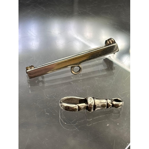 71 - A small silver dog clip a silver watch fob and silver three pence