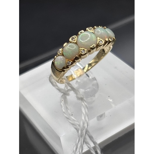 72 - A attractive five stone opal and diamond ring 9ct size R 3.2 gms in early ring box