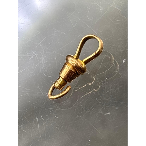 74 - A smaller gold dog clip 14ct gold tested 0.8 gms