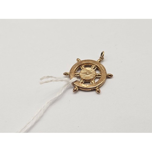 16 - An unusual ships wheel charm 9ct 2.1g
