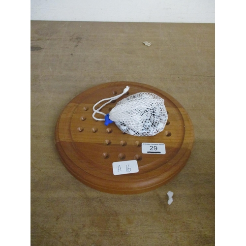 29 - A SOLITAIRE BOARD & MARBLES
