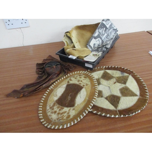 42 - A LEATHER MASK, A SKIN, PLACEMATS, ETC