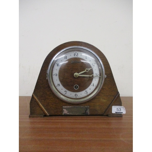 53 - AN OAK CASED MANTEL CLOCK