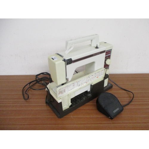 59 - AN ELECTRIC SEWING MACHINE