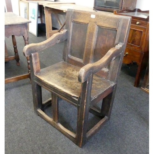 122 - A RARE AND EARLY OAK PANELLED BACK OPEN ARMCHAIR