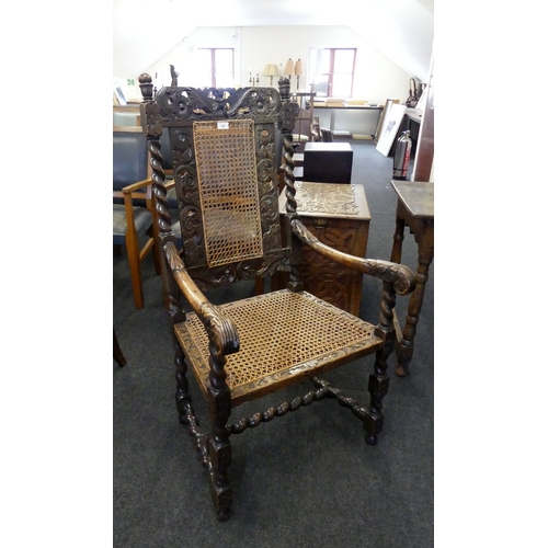 45 - A CARVED OAK ARMCHAIR, BARLEY TWIST SUPPORTS, CANE BACK & SEAT