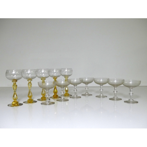 543 - A set of 5 Stem Glasses, etched decoration and coloured stems, together with 7 Champagne Bowls