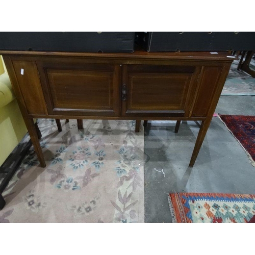 1174 - Early 20th century walnut two-door cabinet on square section tapering supports, 106.5cm x 74cm