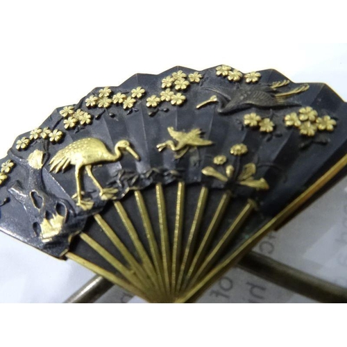 121 - Japanese bronze and gilt metal menu holder, fan-pattern and embossed with crane and water lilies, ea... 