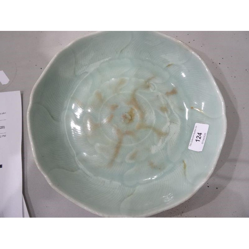 124 - Chinese porcelain shallow dish, celadon glaze with incised waves, 23cm diameter