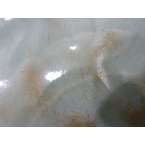 124 - Chinese porcelain shallow dish, celadon glaze with incised waves, 23cm diameter