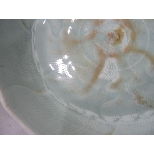 124 - Chinese porcelain shallow dish, celadon glaze with incised waves, 23cm diameter