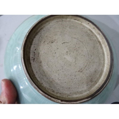 124 - Chinese porcelain shallow dish, celadon glaze with incised waves, 23cm diameter