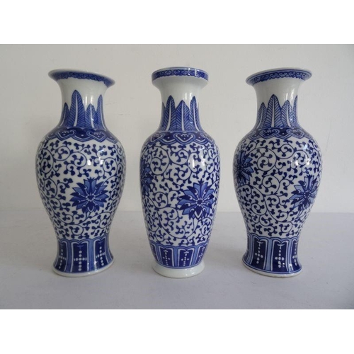 137 - Pair Chinese porcelain baluster vases with underglaze blue decoration of flowerheads, on a scrolling... 