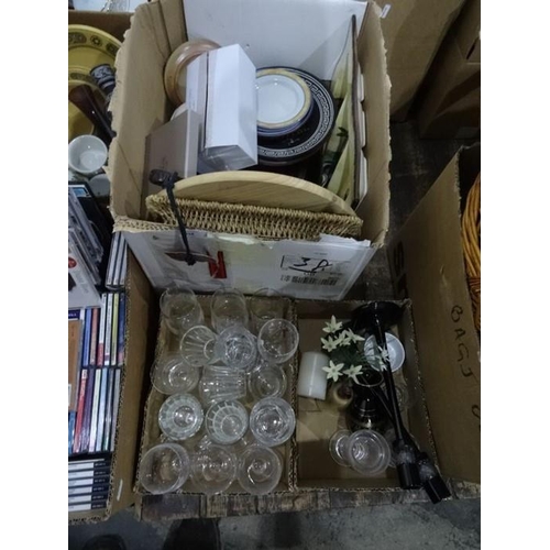 324 - Four boxes of assorted china, glass and homewares to include wine glasses, candlesticks, plates, Pat... 