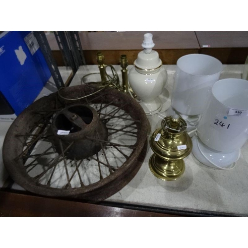 330 - Cast iron vintage cart/car wheel, a pair of brass table lamps, a pair of glass table lamps, a paraff... 