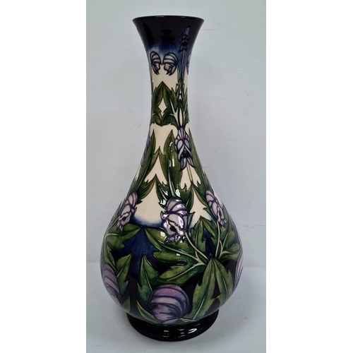 37 - Tall Moorcroft 'Wolfsbane' vase of baluster form decorated with purple flower, marked to base 'Anji ... 