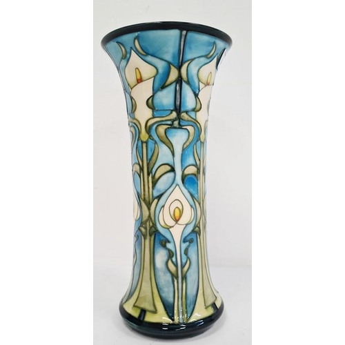 44 - William Moorcroft vase in cream, blue and greens with flared rim, marked ‘Moorcroft’ to base and dat... 