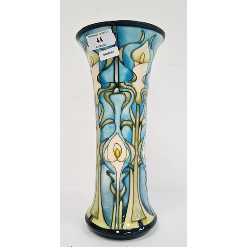 44 - William Moorcroft vase in cream, blue and greens with flared rim, marked ‘Moorcroft’ to base and dat... 