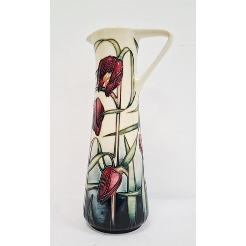 48 - Moorcroft ewer, cream ground with pink fritillary, signed ‘Philip Gibson 2001’, 24cm high