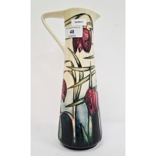 48 - Moorcroft ewer, cream ground with pink fritillary, signed ‘Philip Gibson 2001’, 24cm high