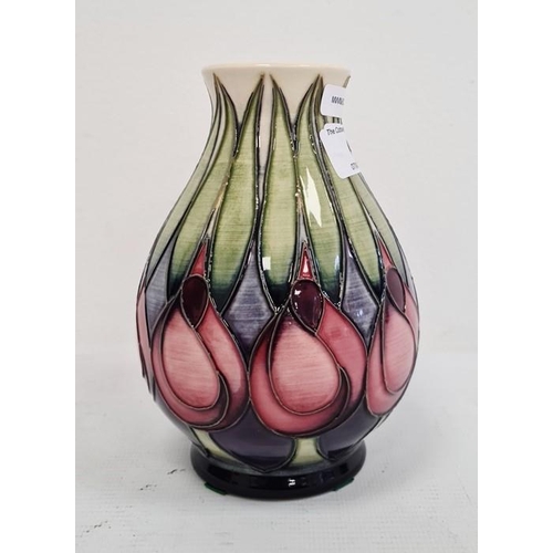 64 - Moorcroft vase with pink and blue flowers with green leaves, cream ground, baluster form, dated 2002... 