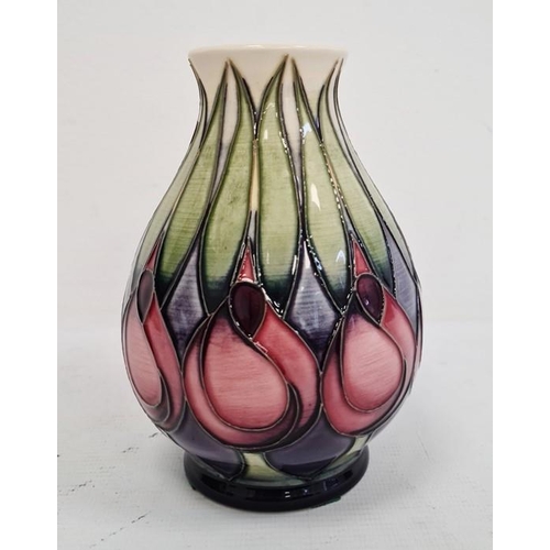 64 - Moorcroft vase with pink and blue flowers with green leaves, cream ground, baluster form, dated 2002... 