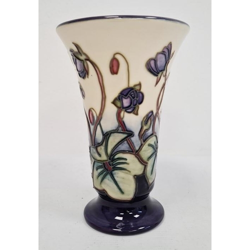 66 - Moorcroft vase of tapering form, cream ground with blue base, violet decoration, initialled ‘JW’ and... 