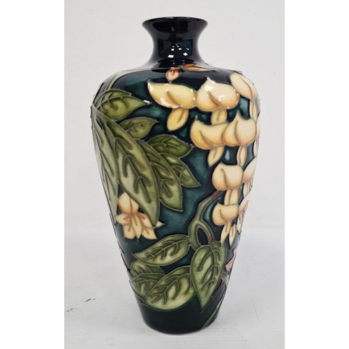 67 - Moorcroft vase, green leaf and white flower decoration, initialled ‘M.C.C.’ and dated 98, 19cm high