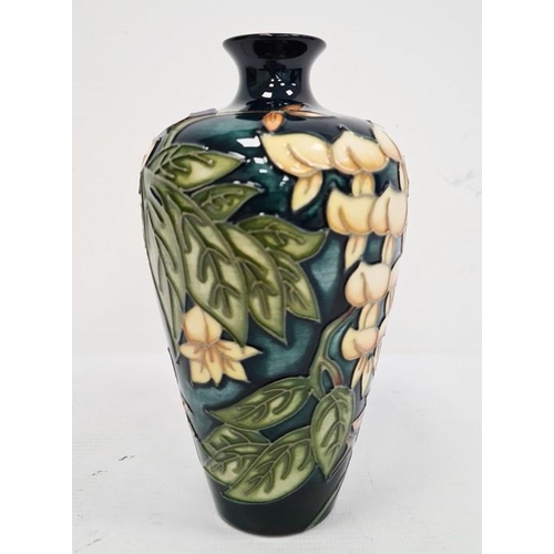 67 - Moorcroft vase, green leaf and white flower decoration, initialled ‘M.C.C.’ and dated 98, 19cm high