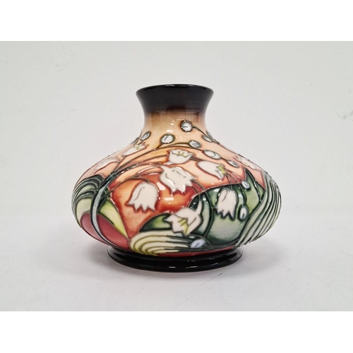 74 - Moorcroft pottery vase, squat baluster-shape with lily of the valley decoration, on an ochre ground,... 