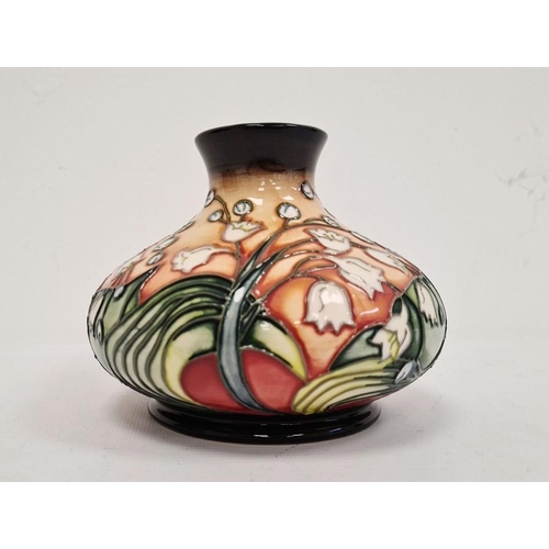 74 - Moorcroft pottery vase, squat baluster-shape with lily of the valley decoration, on an ochre ground,... 