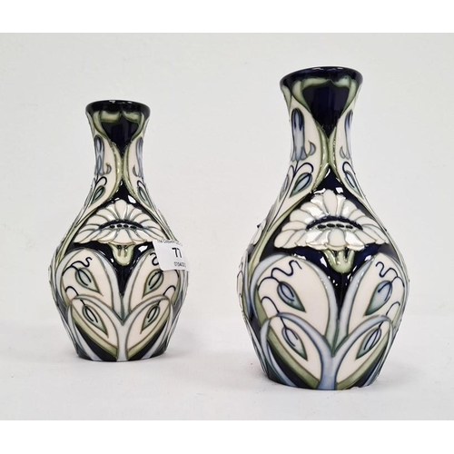 77 - Pair of Moorcroft pottery vases, each ovoid with slender neck, tube-lined decoration of convulvous a... 