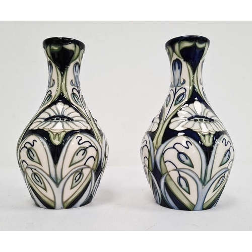 77 - Pair of Moorcroft pottery vases, each ovoid with slender neck, tube-lined decoration of convulvous a... 