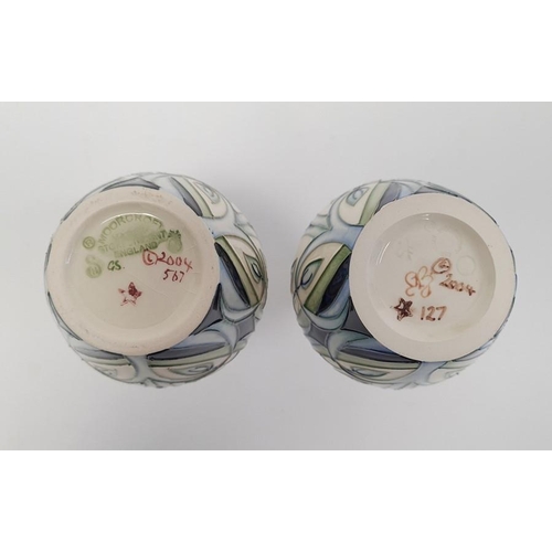 77 - Pair of Moorcroft pottery vases, each ovoid with slender neck, tube-lined decoration of convulvous a... 