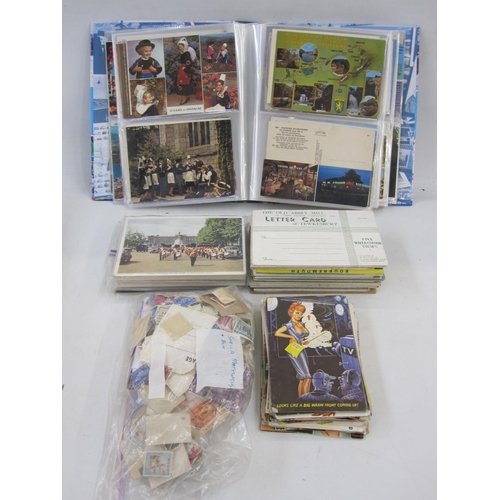 209 - Three albums of postcards, Edward VII to modern, seaside and country views of GB and abroad, several... 