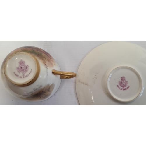 105 - Royal Worcester demi-tasse and saucer, printed puce marks, printed date code for 1929, the cup paint... 