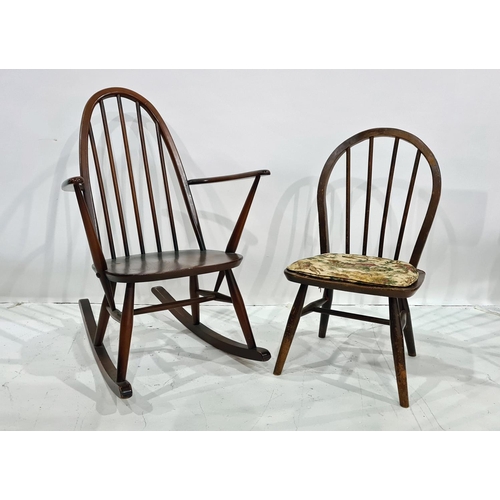 1388 - Dark elm seated Ercol stickback rocking chair and one further chair (2)