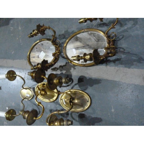 272 - Three various gilt-framed mirrors, a pair of brass mirrored electric light sconces, a another pair o... 