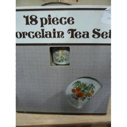 274 - 18 piece porcelain tea service, boxed, various vintage biscuit and sweet tins, moulded glassware, a ... 