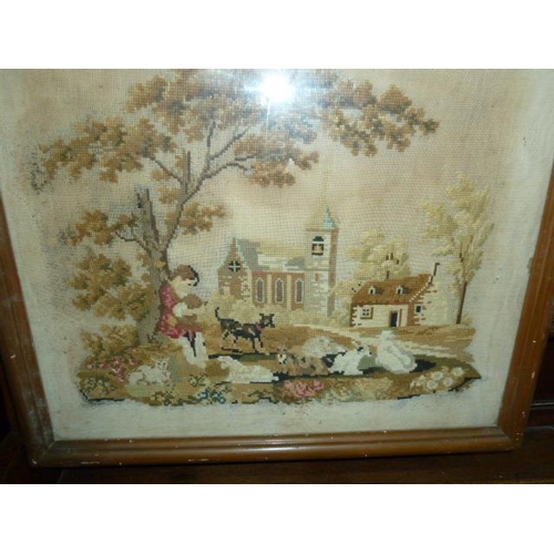 322 - Late 19th century petitpoint needlework picture showing a boy sitting with a dog, dogs in the foregr... 