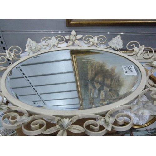 340 - Oval-shaped mirror with a decorative metal frame showing daffodils, three framed prints, a framed pi... 