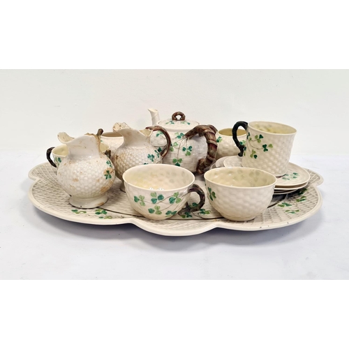 66 - Belleek porcelain cabinet set comprising lobed oval tray, teapot with branch-pattern bifocated handl... 